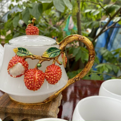 Bộ ấm trà chạm cây vải đá bạch ngọc