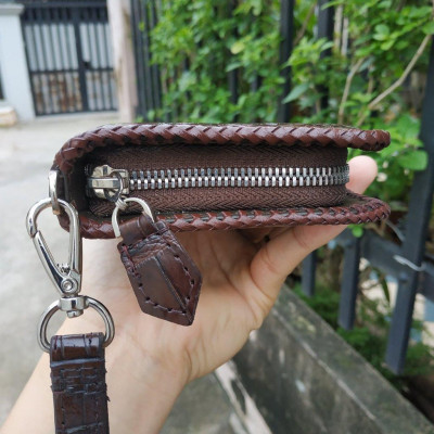 Ví cầm tay gù cá sấu 