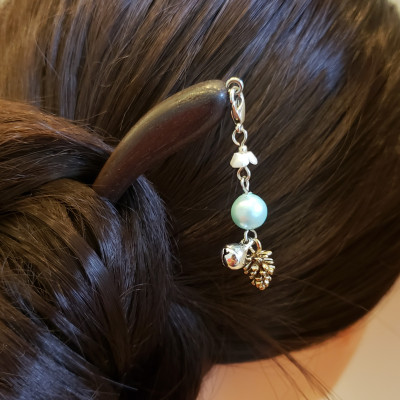 TRÂM CÀI TÓC TUA RUA QUẢ THÔNG