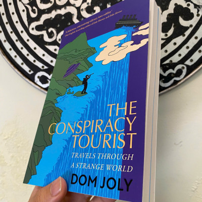 Sách - The Conspiracy Tourist: Travels Through a Strange World by Dom Joly | Travel Nonfiction